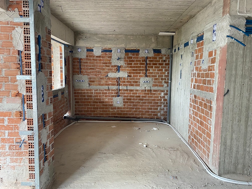 Concealed electrical wiring work at a construction site